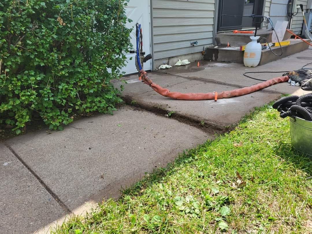 Residential driveway and walkway void filling in Fargo ND neighborhood