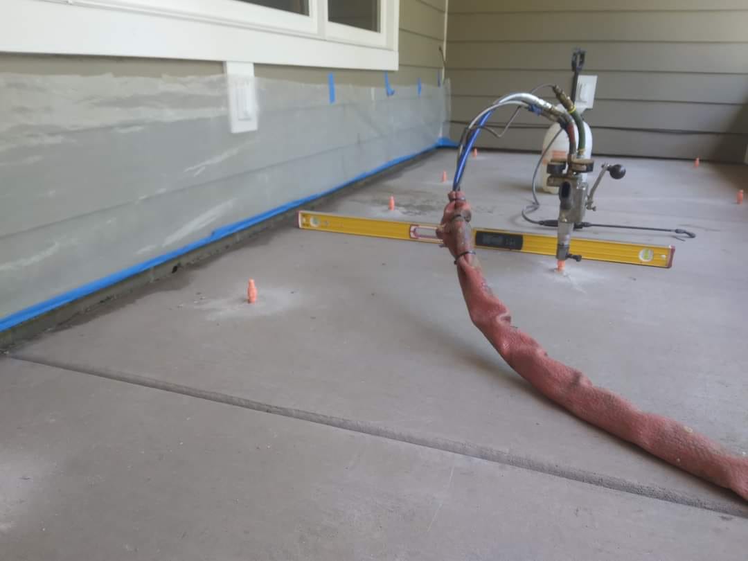 Polyurethane foam lifting equipment set up on residential concrete slab in Minnesota