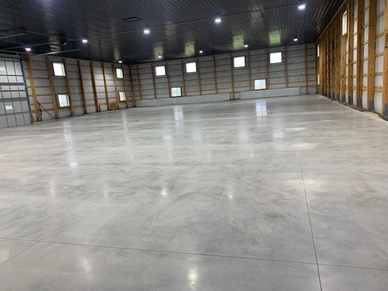Large metal building with stunning high gloss polished concrete floor