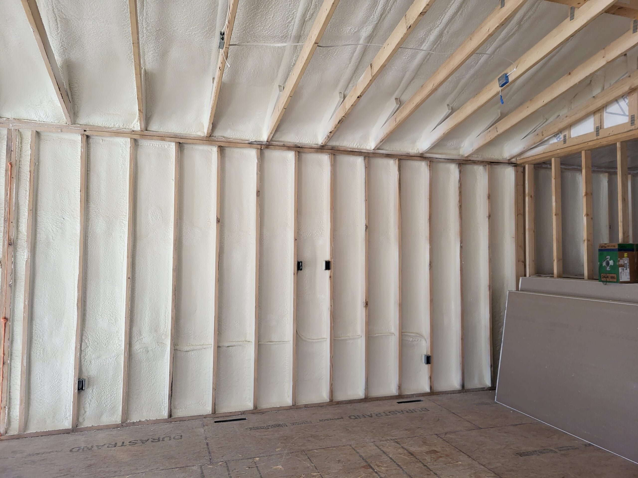 Spray foam insulation applied on walls and ceiling in new commercial construction – Upper Midwest SPF contractor TCS