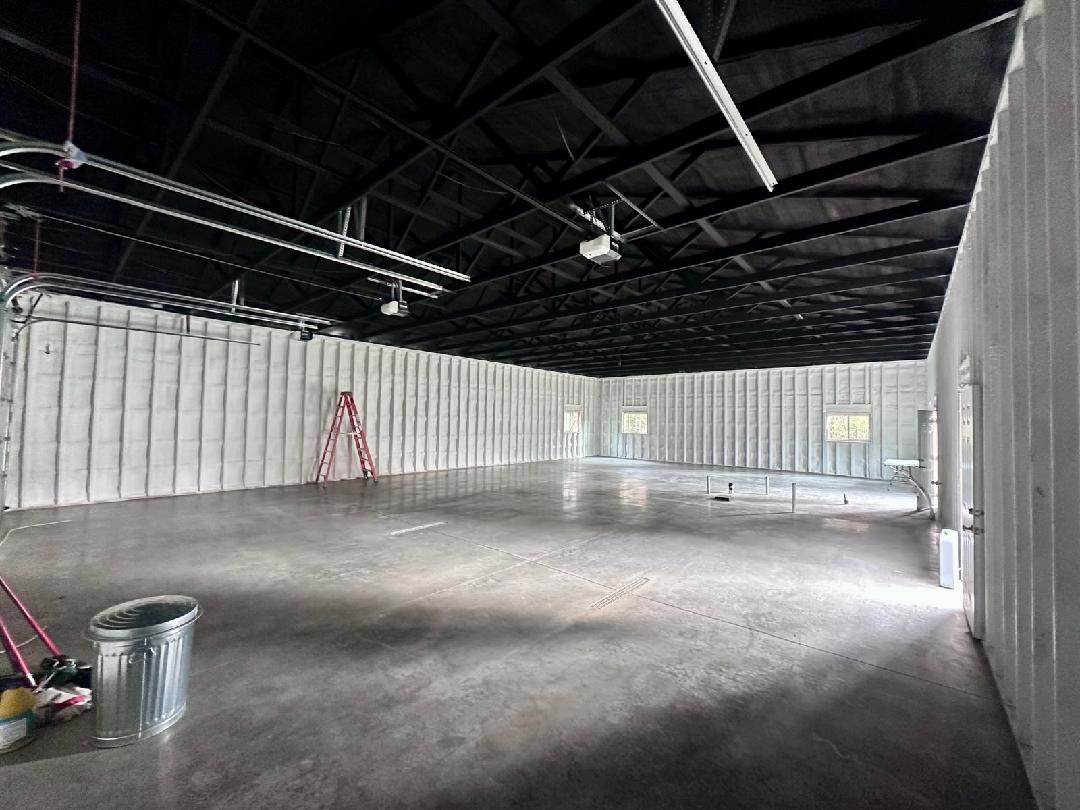 Commercial space with polished concrete floor and spray foam insulated walls — Upper Midwest working building concrete polishing by TCS